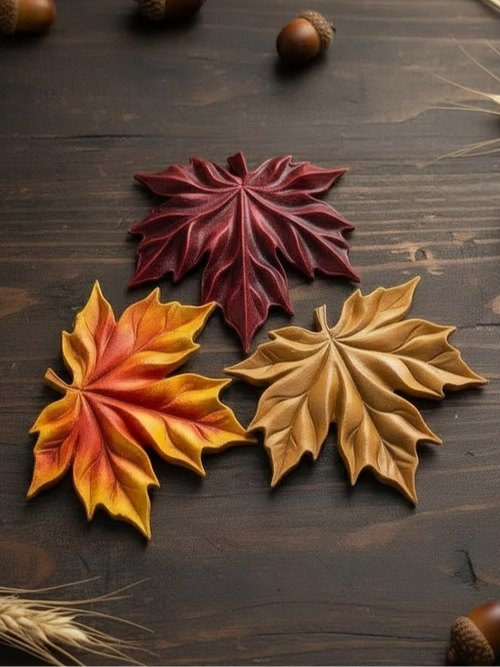 Décoration de feuilles en relief rouge, jaune-orange et beige